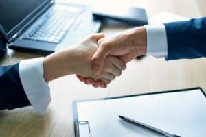 colleagues at work successful deal desire hands conclusion of a contract. High quality photo