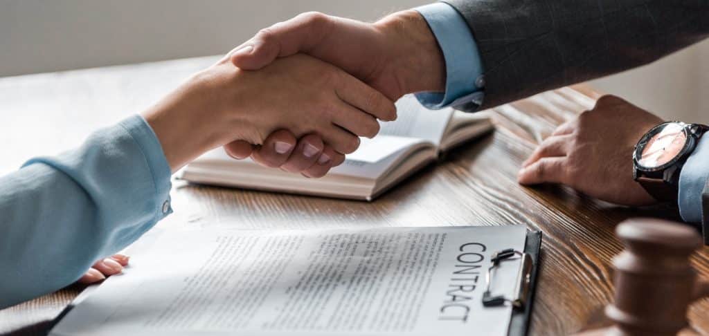 lawyer-client-shaking-hands-contract