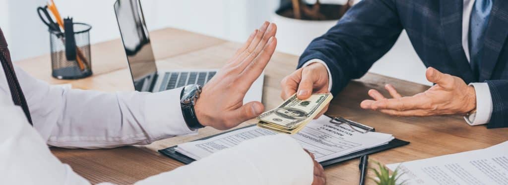 worker-rejecting-money-giving-businessman-blue-jacket-office
