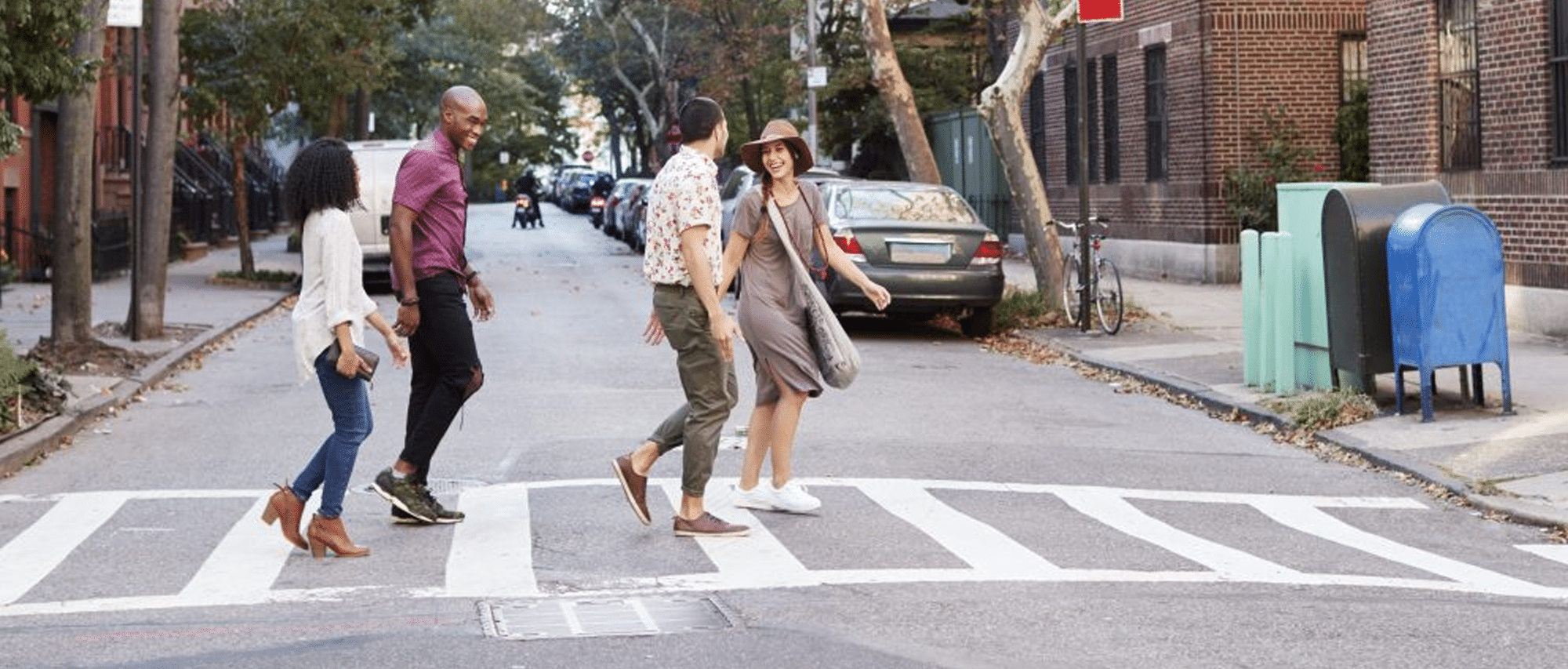 Group-Of-Friends-Crossing-Urban-Street-In-New-York-City