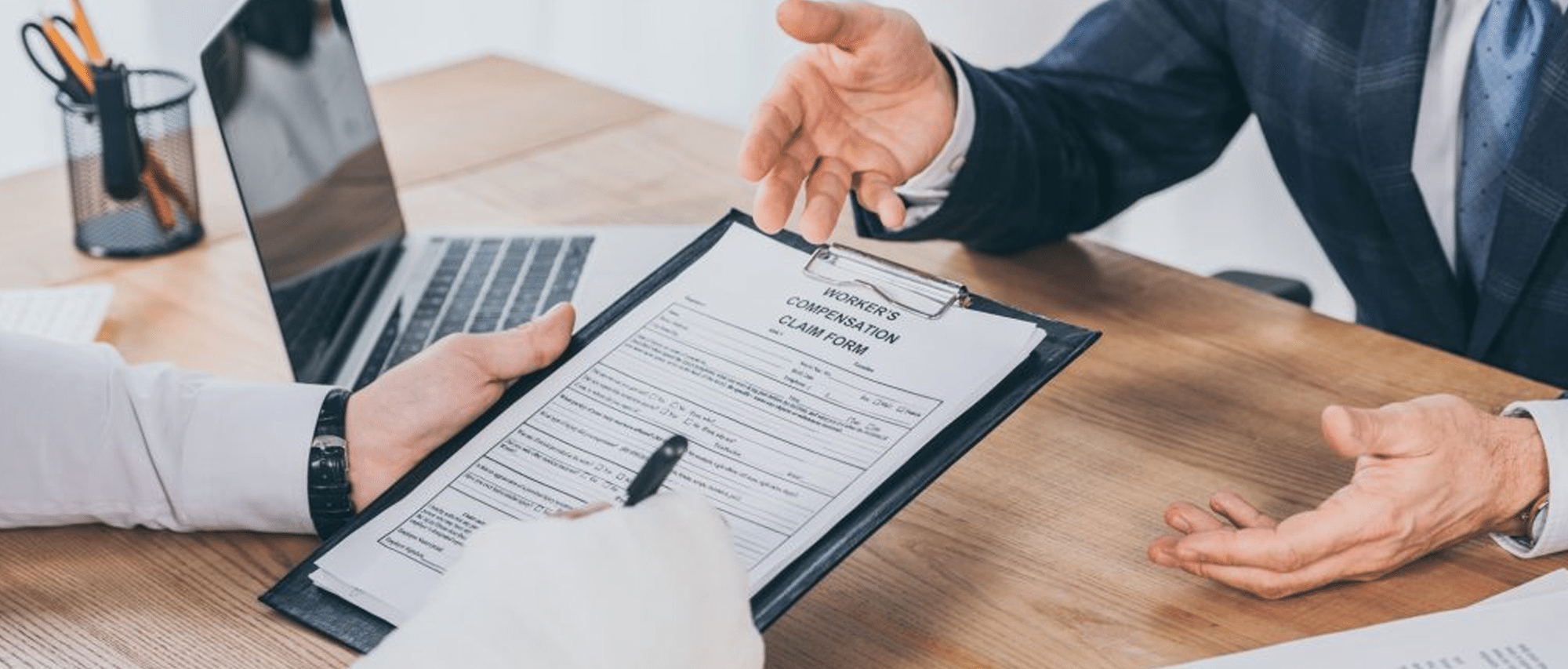 worker-broken-arm-signing-form-compensation-claim-businessman